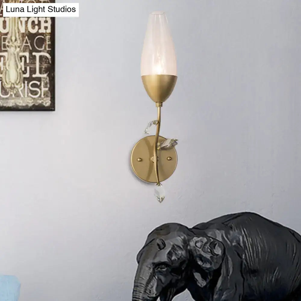 Modern gold crystal leaf wall sconce with frosted glass shade and crystal leaf design in gold finish for bedroom lighting