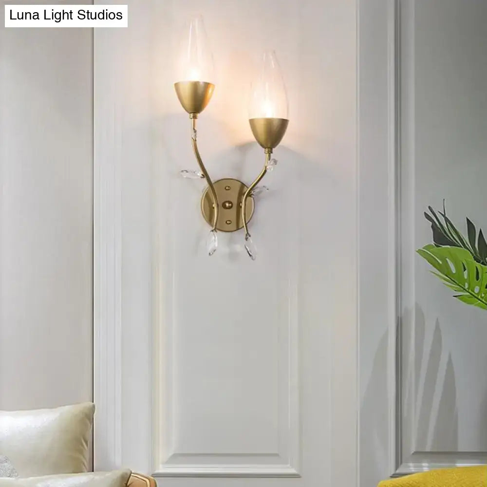 Modern gold crystal leaf wall sconce with gold finish, crystal leaf design, two upward glass shades for bedroom lighting