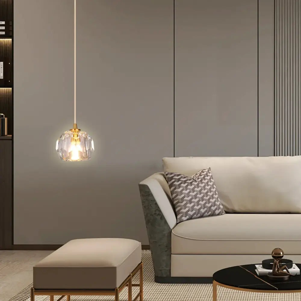 Modern gold crystal led ceiling chandelier with clear faceted glass globe and gold metal hardware for dining room
