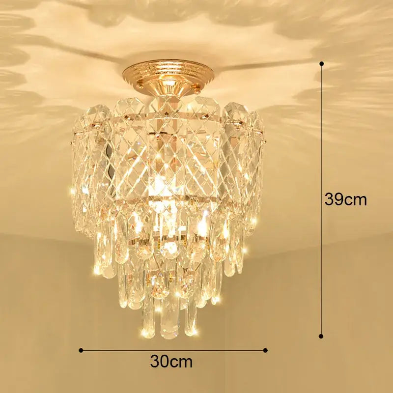Modern gold crystal led ceiling chandelier with cascading clear prisms and teardrop crystals for dining room decorbites crystal led