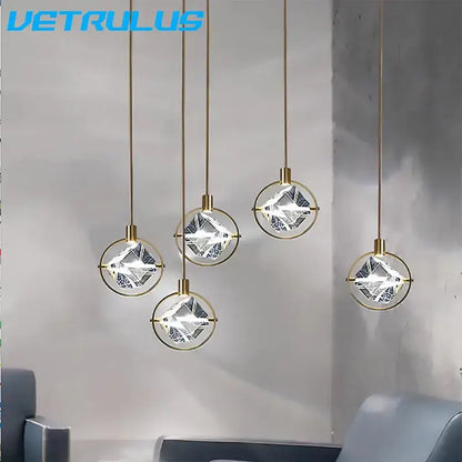 Five modern gold crystal led ceiling pendant lights with faceted clear spheres for dining room decorbites crystal led
