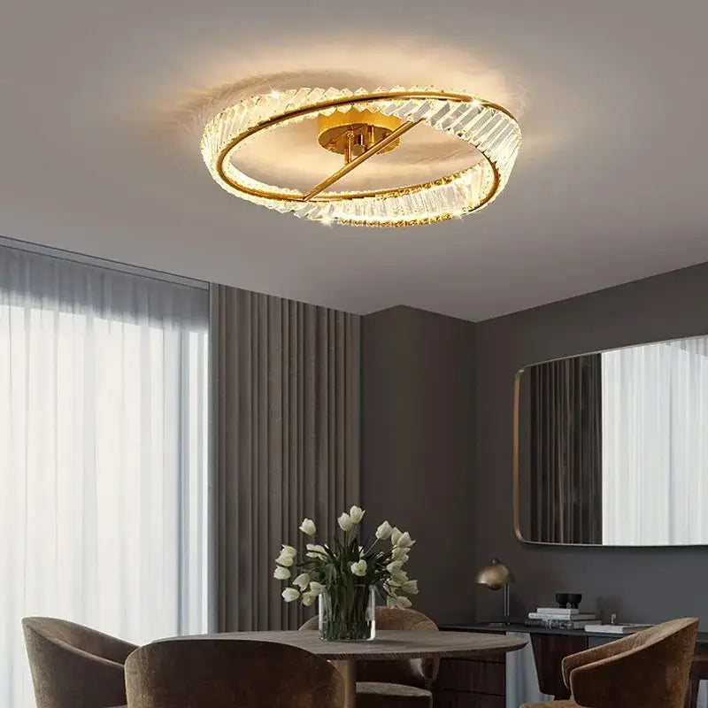Modern gold crystal led chandelier ceiling lights with faceted crystal rings emitting warm light for living room decor