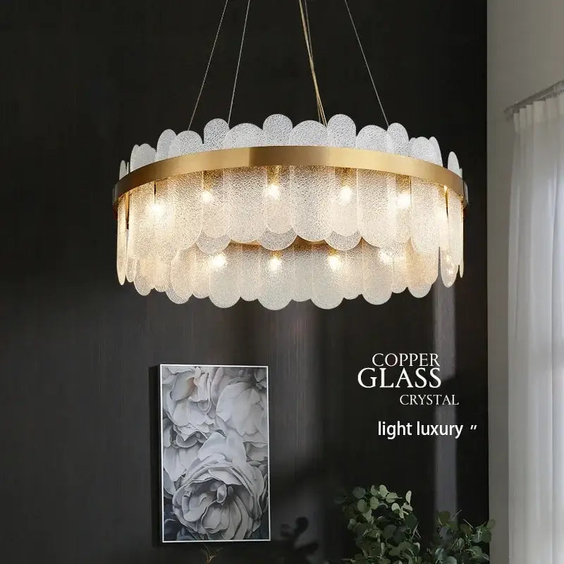 A modern decorbites crystal led chandelier with gold metal frame and frosted glass petals emitting warm light