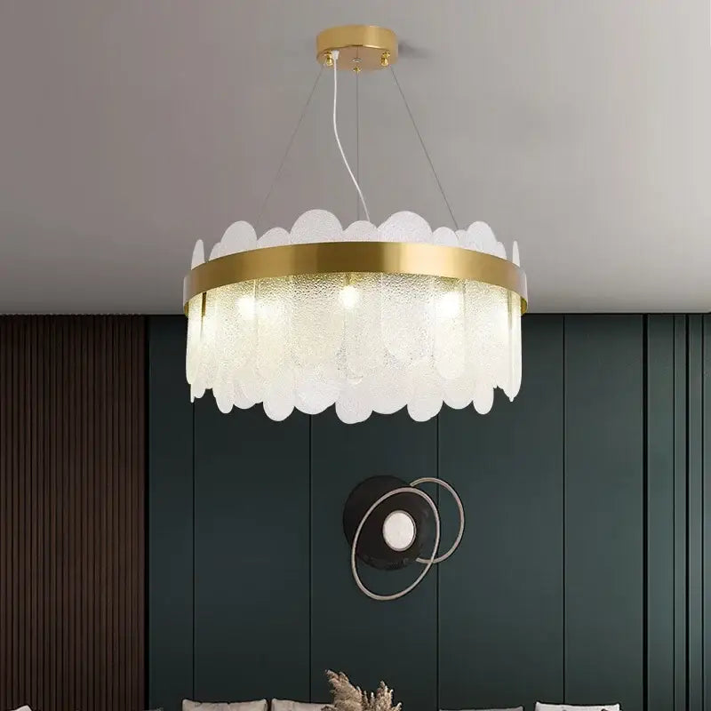 A modern gold crystal led chandelier with frosted glass petals and a metal frame for elegant living room decorbites crystal led lighting
