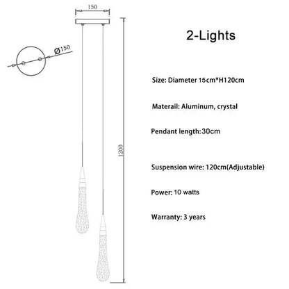 A modern gold decorbites crystal led pendant light with teardrop crystal shades and aluminum mount for dining room decor
