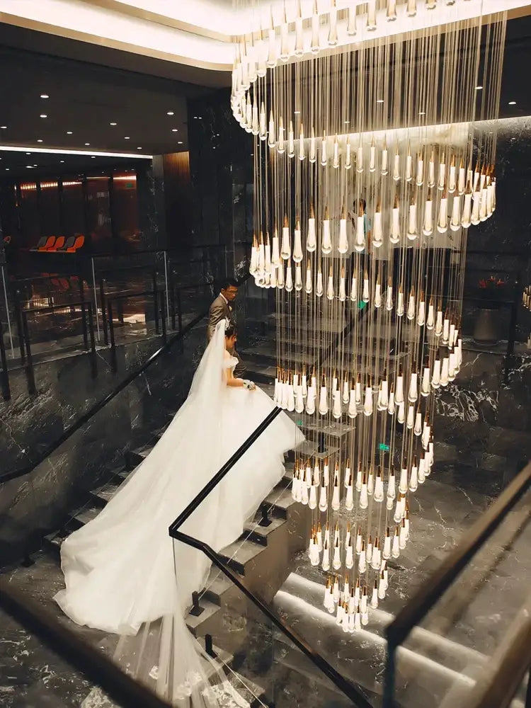 Modern gold crystal led pendant chandelier with cascading tiers of crystal pendants and gold-toned accents for living room decorbites crystal led