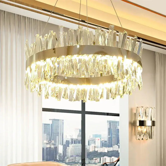 Modern gold crystal led pendant light with a circular metal frame and cascading clear crystals by decorbites pendant light