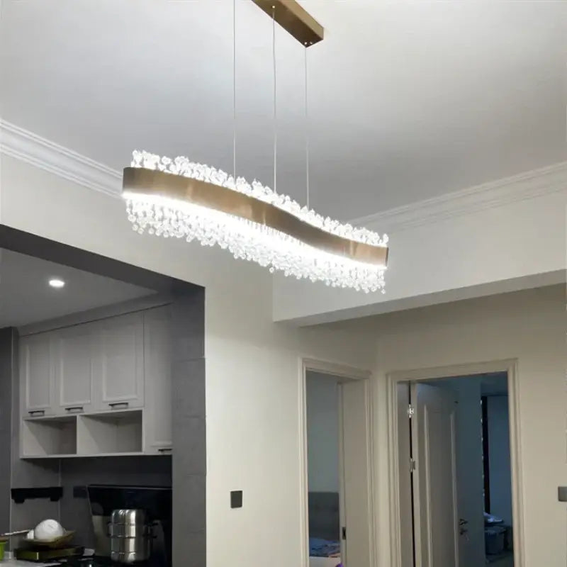 Modern rectangular DecorBites LED pendant lights with sleek gold metallic frame and cascading crystal droplets for elegant spaces