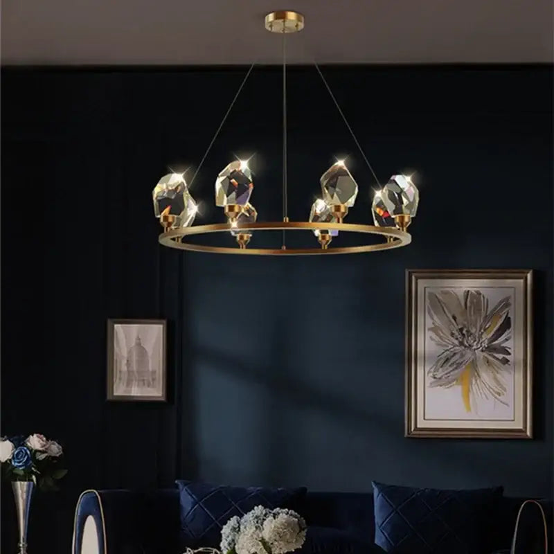 Modern gold crystal led pendant lights featuring a gold-toned circular chandelier with faceted crystal led pendant accents for dining room