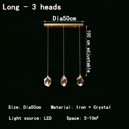 Modern gold-toned three-head led pendant lights with dangling crystal pendants for dining room illumination