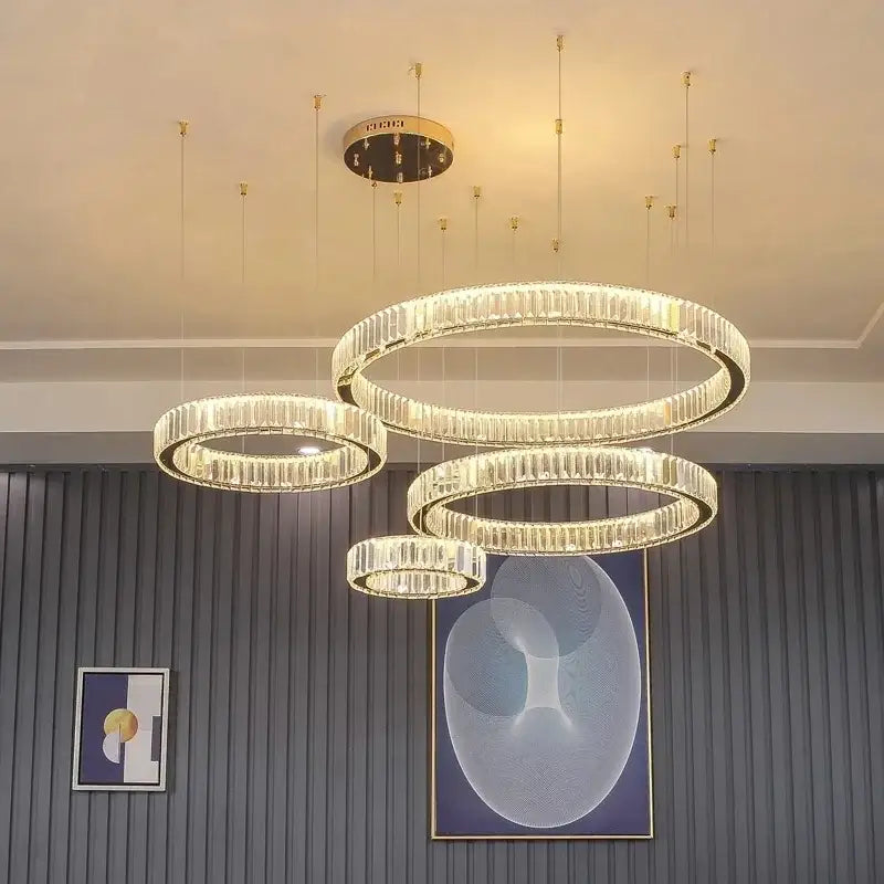 Modern gold crystal led ring chandelier with multiple concentric rings of faceted crystals on sleek metal frame