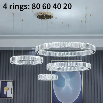 Modern gold crystal led ring chandelier with four concentric rings of faceted crystals in polished metal frame ideal for stairwells