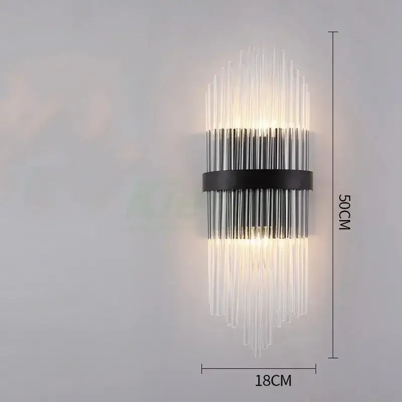 Modern gold crystal led wall lamp with clear glass rods and black metal band emitting warm light for bedroom decorbites crystal led