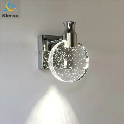 Modern gold crystal led wall lamp featuring chrome finish and clear glass globe with embedded sparkling particles decorbites crystal led