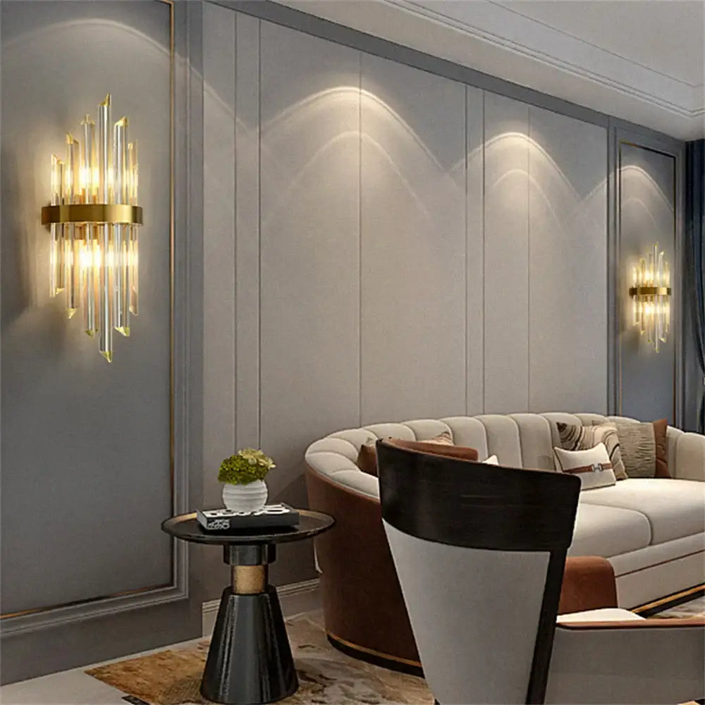 Modern gold crystal led wall lamp bedroom sconce with vertical crystal rods and circular brass base from decorbites crystal led