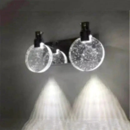 Modern gold crystal led wall lamp with clear circular textured glass and black clips for bathroom lighting
