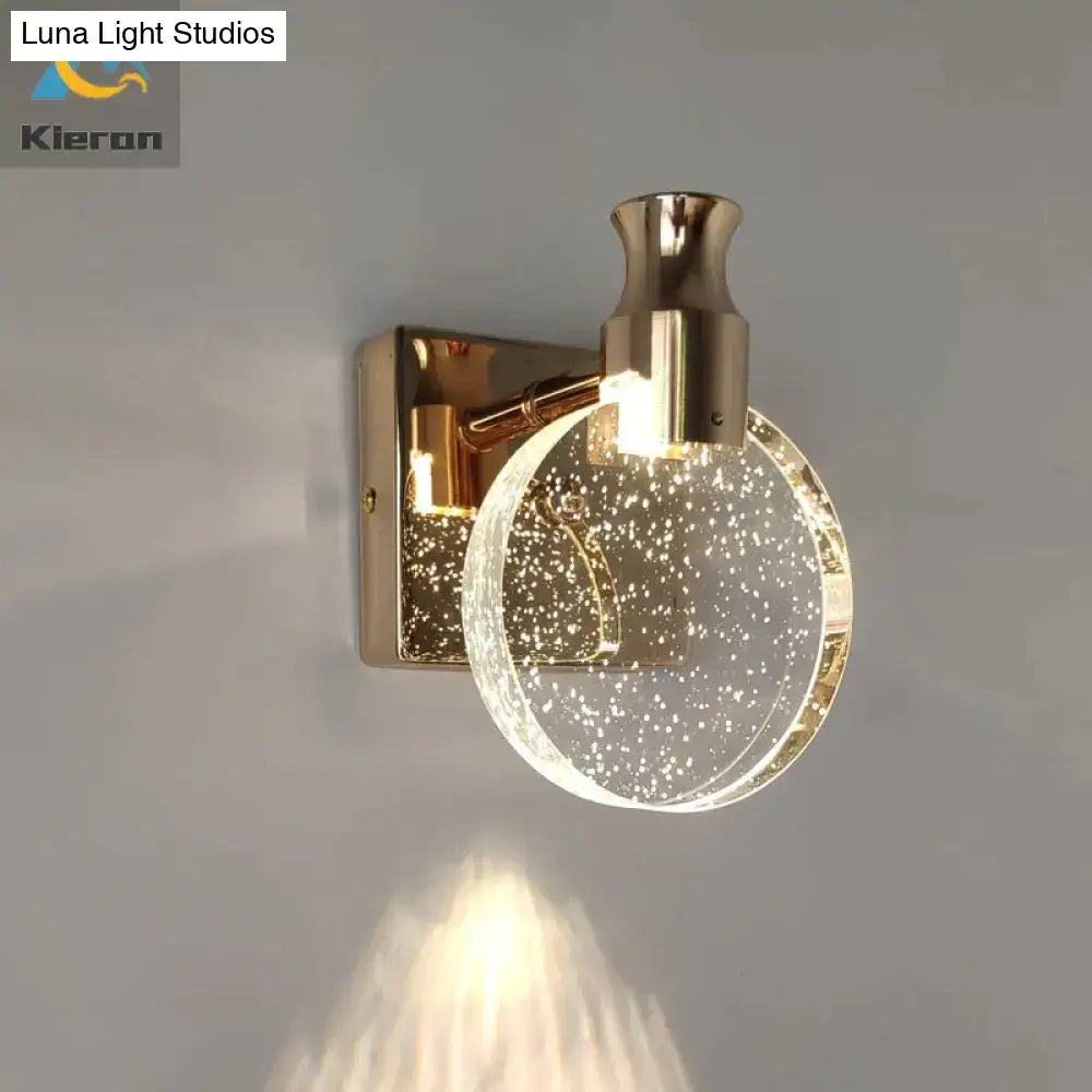 Modern gold crystal led wall lamp with a simple crystal led globe filled with sparkling particles for bathroom use