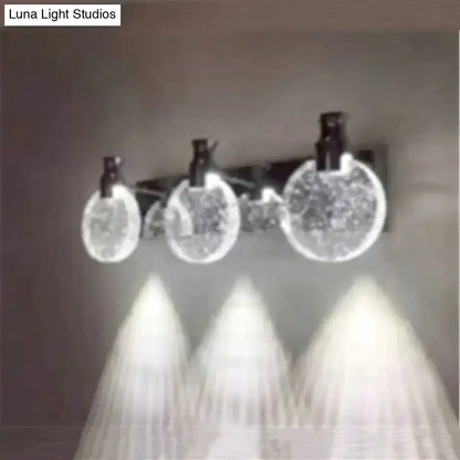 Modern gold crystal led wall lamp with three simple crystal led globe lights and black fixtures for bathroom use