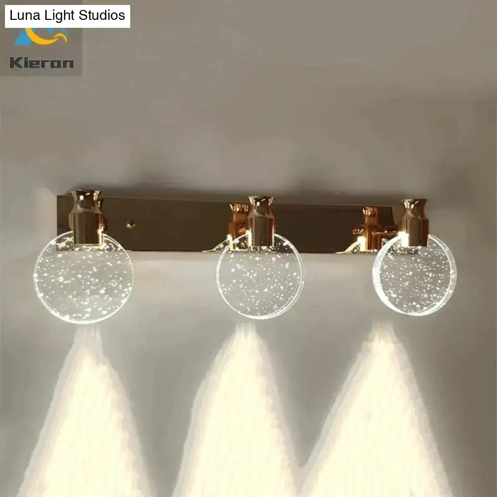 Modern gold crystal led wall lamp featuring three clear sparkling crystal spheres for bathroom lighting