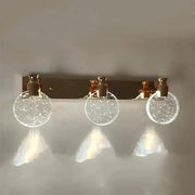 Modern gold crystal led wall lamp with three circular glass globes filled with sparkling particles for bathroom use