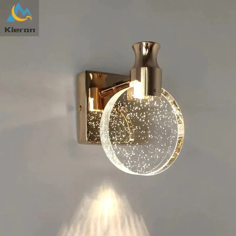 Modern gold crystal led wall lamp with three simple crystal led globes featuring sparkling bubbles for bathroom use