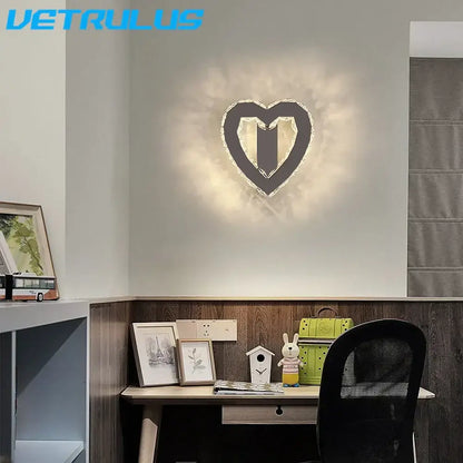 Modern gold crystal led wall light with sleek black frame and crystal accents emitting warm glow for living room decorbites crystal led