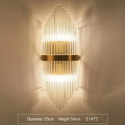 Modern gold crystal led wall sconce with clear glass rods in a vertical radiating pattern for bedroom lighting