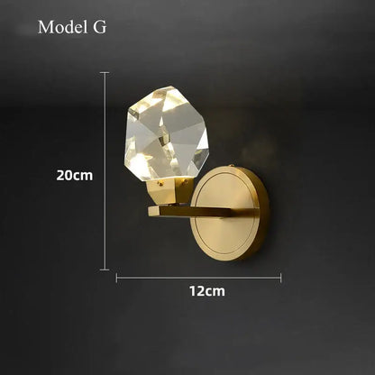 Modern gold crystal led wall sconce with faceted crystal globe on polished brass arm for luxury bedroom decorbites crystal led