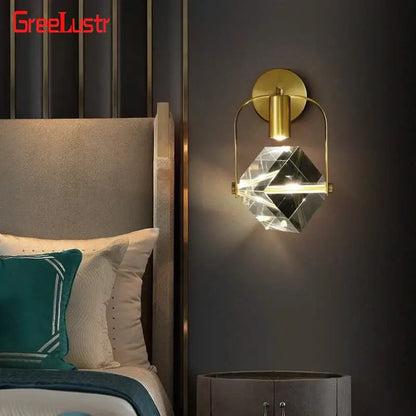 Modern gold crystal led wall sconce with a faceted globe and brass accents for luxury bedroom decorbites crystal led lighting