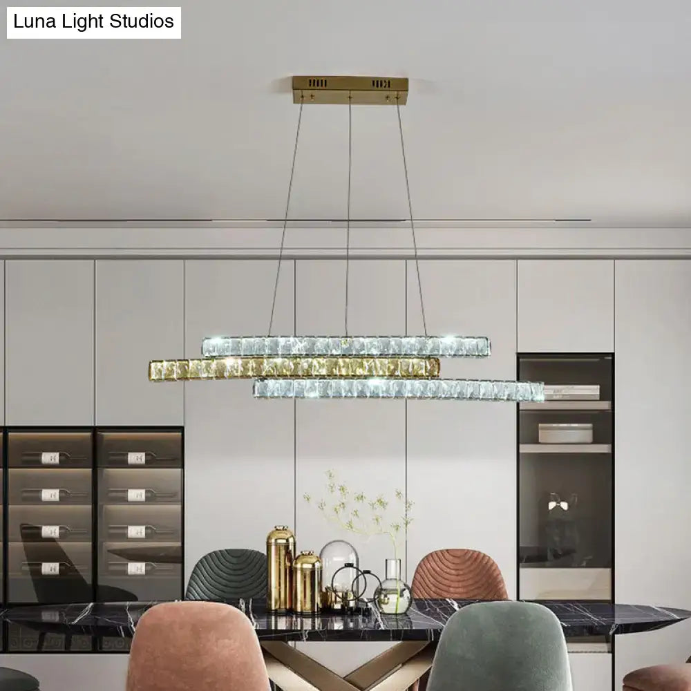 Modern rectangular decorbites gold linear island pendant light with layered crystal and gold-toned metal accents