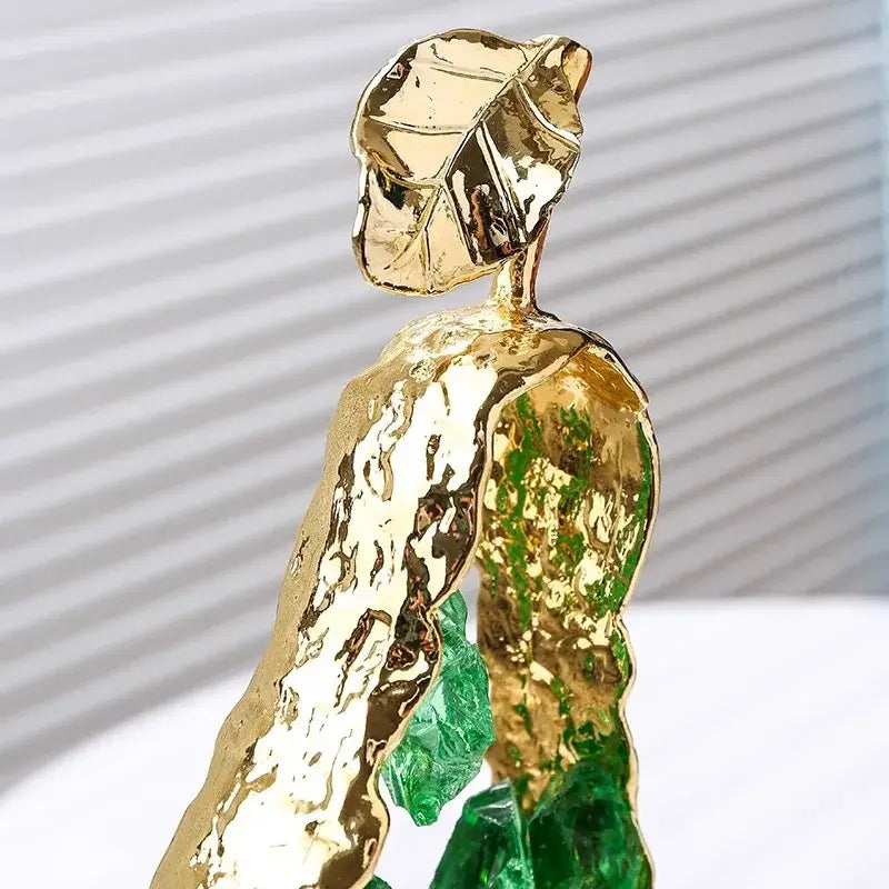 Modern gold crystal metal fruit sculpture set featuring a textured leaf figurine with green glass accents for decorbites decor