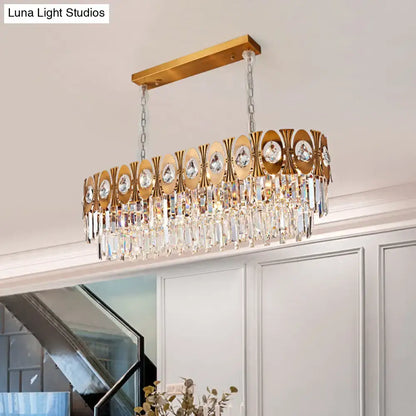 Modern gold crystal oval suspension island pendant light with gold-toned rectangular frame and crystal droplets