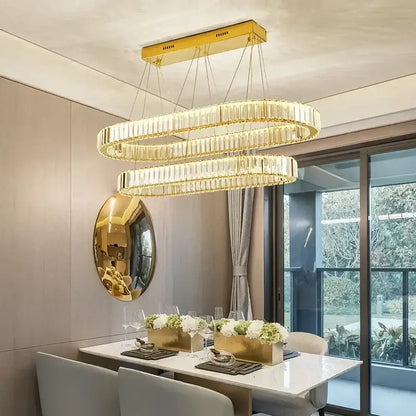 Modern gold crystal pendant chandelier featuring a gold-toned double-ring design with faceted crystal accents decorbites crystal pendant