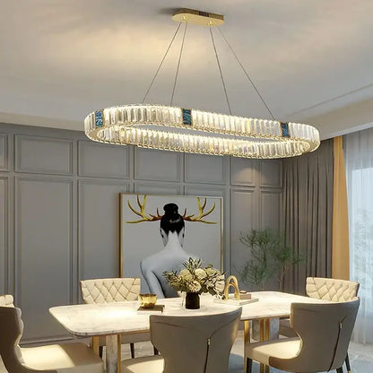 A modern gold crystal pendant chandelier led with clear crystal segments and gold-toned accents for dining room decorbites crystal pendant