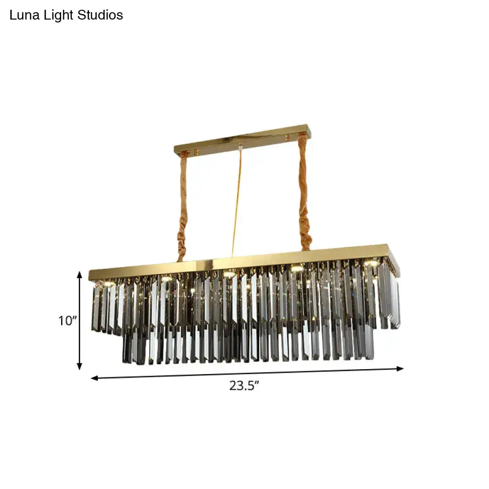 Decorbites modern gold pendant light with rectangular frame and cascading clear crystal prisms suspended by twisted ropes