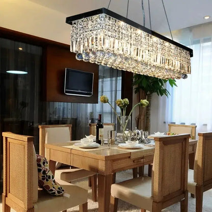 Modern gold crystal pendant light rectangular chandelier with black frame and cascading faceted crystals for dining room