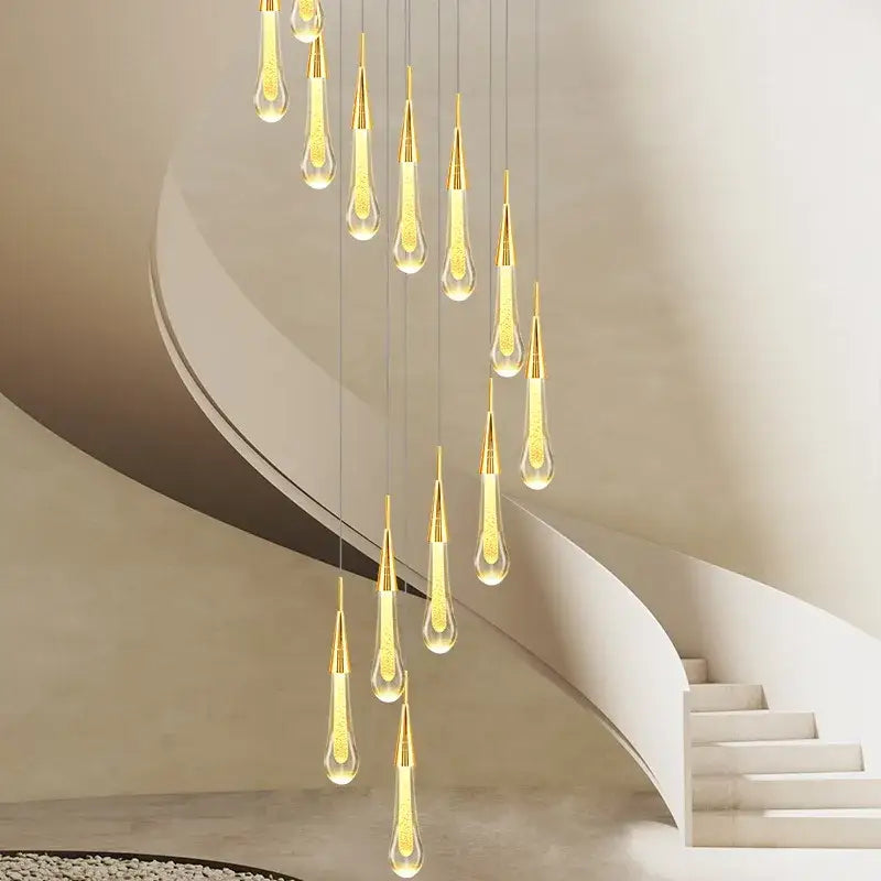 Modern gold crystal raindrop pendant lights with clear glass and etched patterns designed for foyer chandelier use