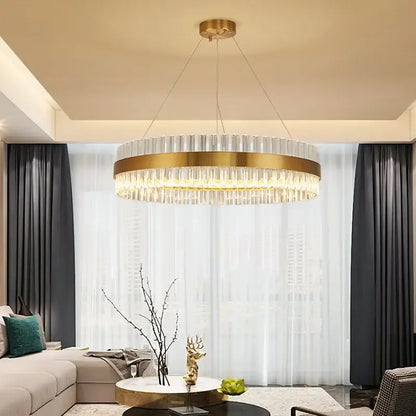 Modern gold crystal ring chandelier with a circular metal frame and clear crystal rods for dining room pendant lighting