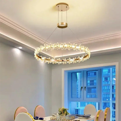 Modern gold crystal ring led chandelier featuring clear flower-shaped crystals for elegant dining room decorbites crystal ring