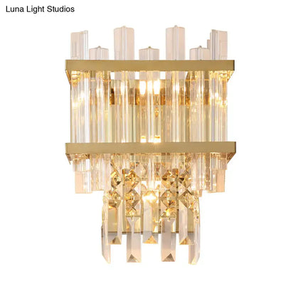 Modern gold direct wired electric wall sconce with cube shade featuring cascading clear crystal rods and faceted prisms