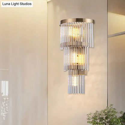 Modern gold crystal rod tiered wall lamp with brushed brass frame and cascading crystal rods for dining room lighting