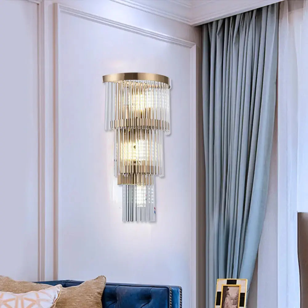 Modern gold wall lamp with crystal rod tiers and clear glass cascades ideal for dining room lighting