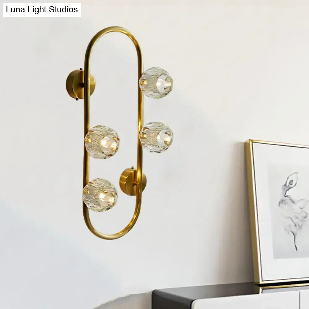 Modern gold wall lamp with five faceted crystal shade globes on curved frame direct wired electric for living room