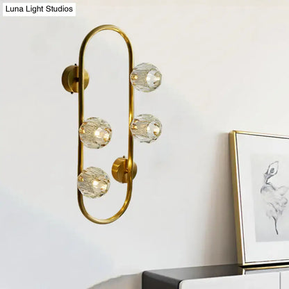 Modern gold wall lamp with five faceted crystal shade globes on curved frame direct wired electric for living room