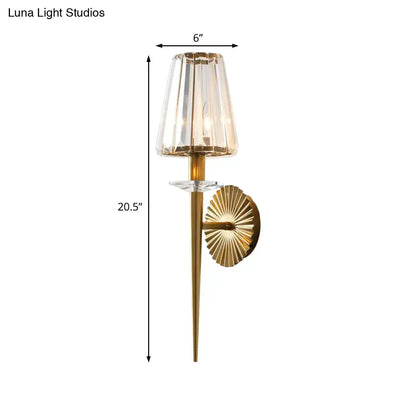 Gold-toned wall light with faceted crystal shade and sunburst backplate for 220v-240v and 110v-120v use