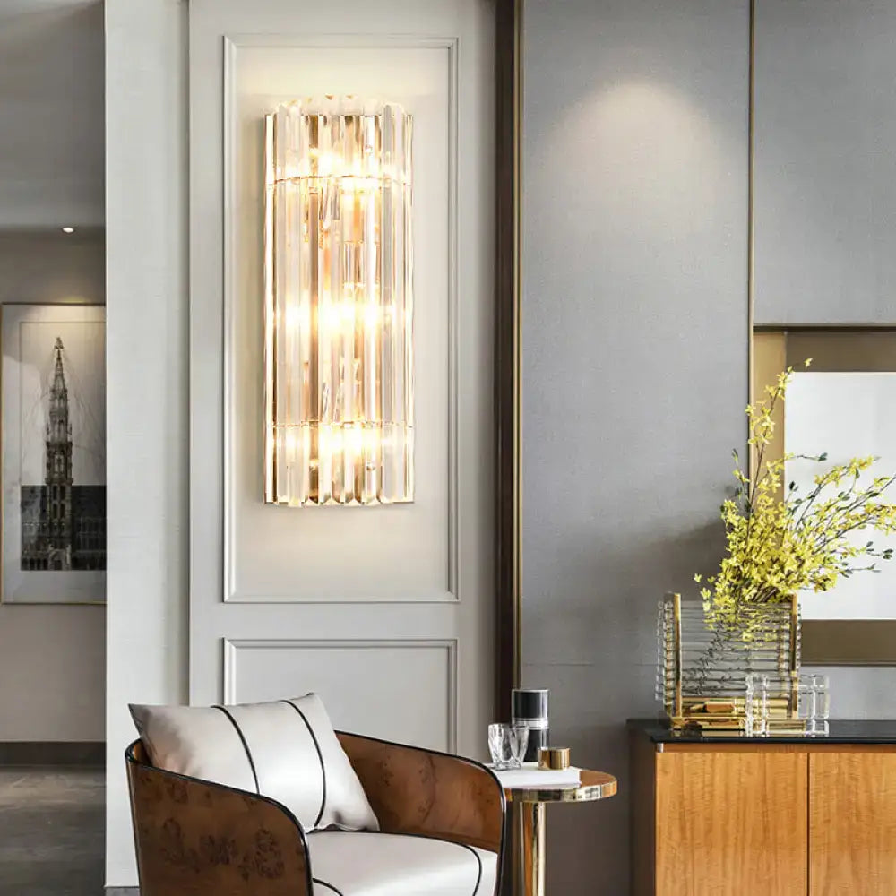 Modern gold crystal shade wall scone with vertical translucent crystal rods and warm led incandescent lighting for living room