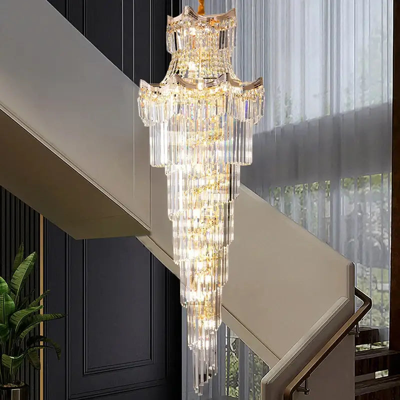 Modern gold crystal stair chandelier with cascading clear glass prisms and gold-toned metal accents by decorbites crystal stair