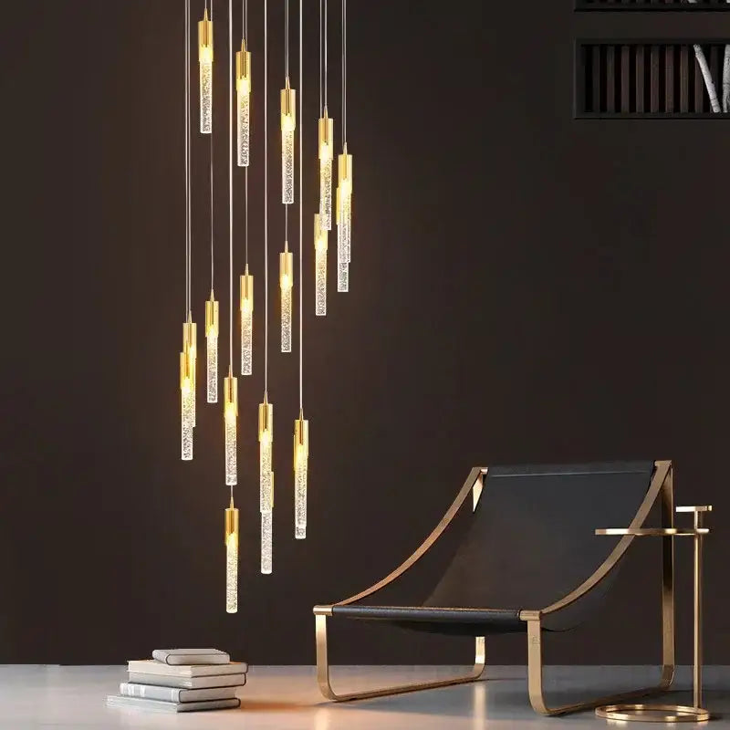 Modern gold crystal staircase chandelier with clear textured glass cylinders in a cascading decorbites crystal stairwell lamp
