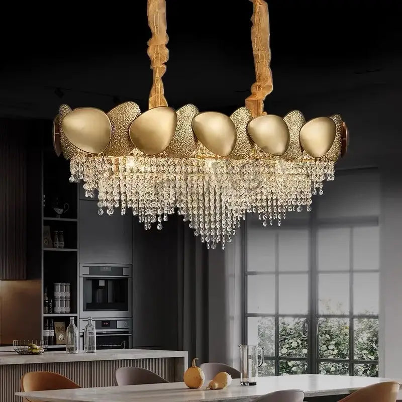 Modern gold crystal tassles pendant light featuring sculptural metallic orbs and cascading crystal tassles chandelier decorbites