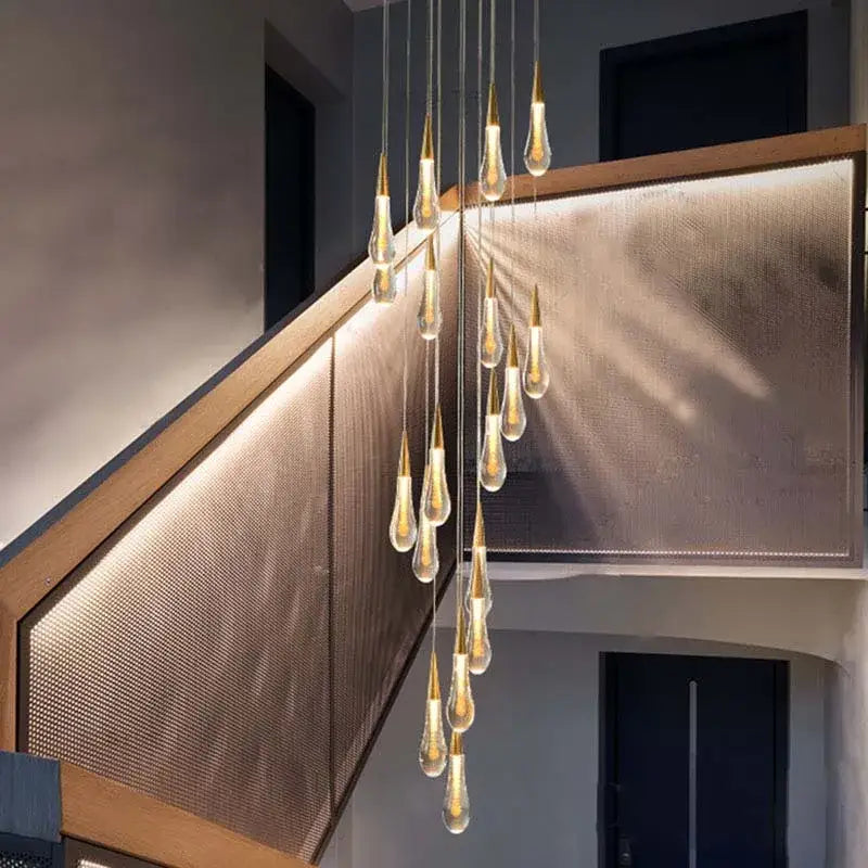 Modern gold crystal tear drop chandelier with multiple teardrop-shaped glass bulbs on thin metal rods for decorbites crystal tear decor